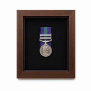 Custom military medal display frame with choice of frame finishes and velvet backing colours, including dark wood, black, oak, white, grey and luxury velvet options.